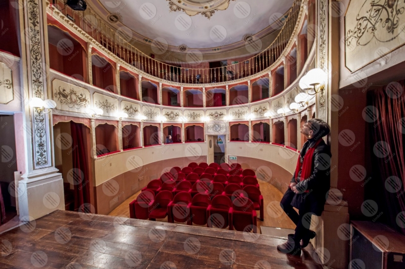 Caporali Theatre interior parterre seats frescoes colors art woman shows  Panicale